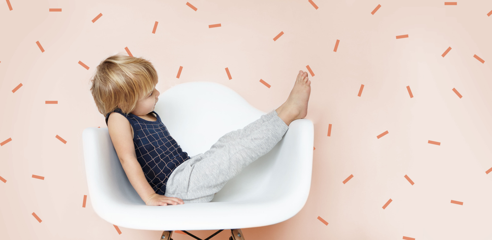 Young child playing on the chair