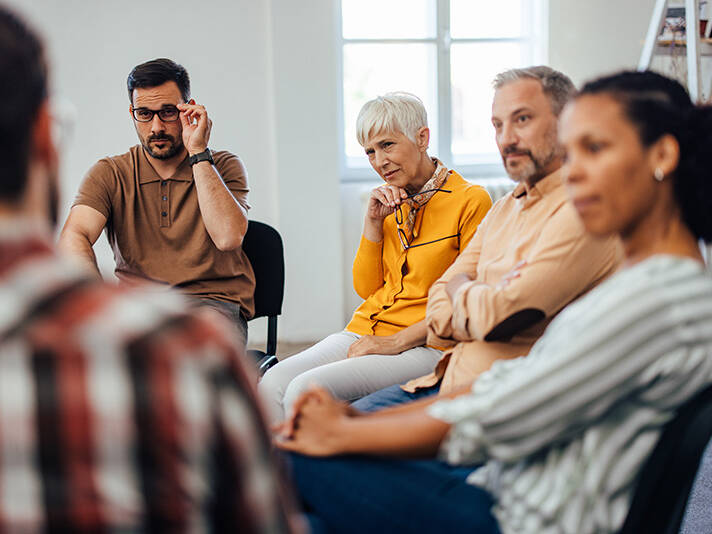 Adults talking in a circle