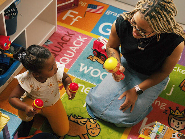 FirstSpark Teacher and Student with Maracas